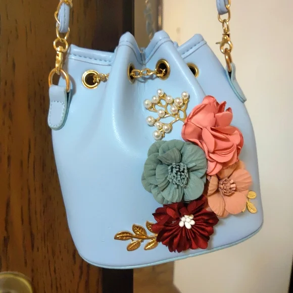 Blue Floral Faux Leather Bucket Bag with Brass Details - Picture 1 of 6